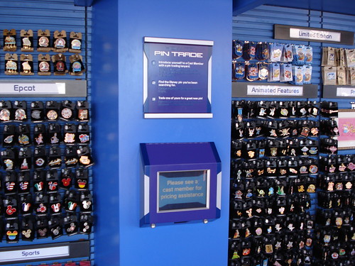 They've added this sign to tell guests how to trade and also a screen that will soon tell guests how much pins are just by scanning the UPC bar code.