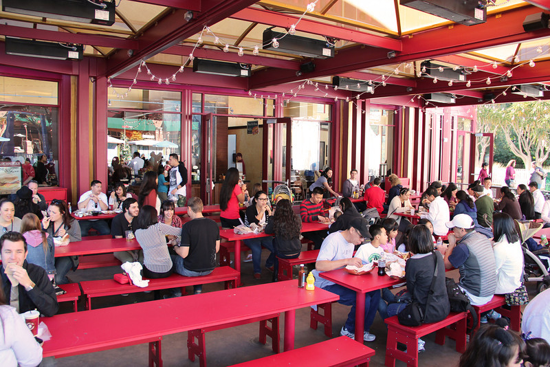 Picnic table style outdoor seating. This is perfect if you like sitting with people you've never met before.