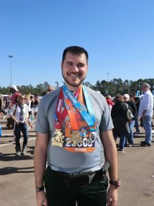 Michael with the Goofy Challenge medals.