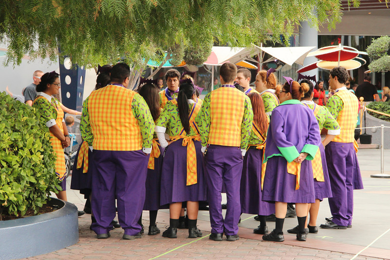 Cast members pre-brief  before staffing the treat stations...