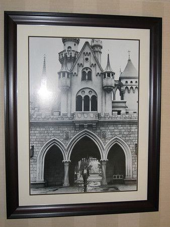 The picture on the wall of the bedroom shows Walt under Sleeping Beauty's Castle.  A great tribute to a great man.