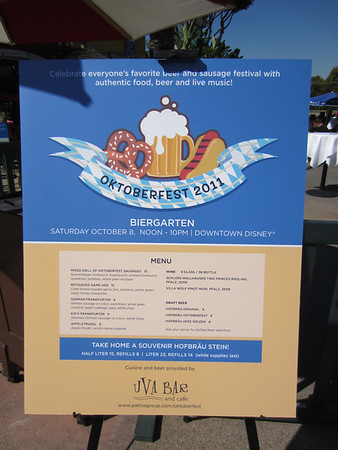 Menu includes a selection of German foods including various sausages, game hen, and 