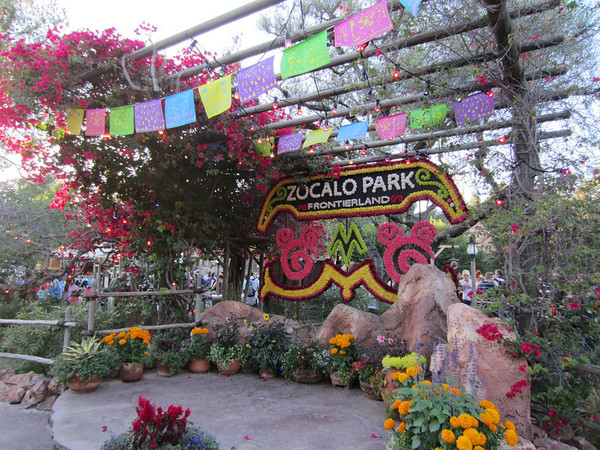 Celebrating El Dia de Los Muertos with lots of skeletons and colorful decorations.