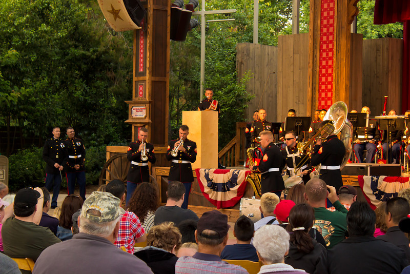 The Marine on the far left is not wearing a white belt because he is an officer, and they wear different belts. The Marine on the far left is not wearing a white belt because he is an officer, and they wear different belts.