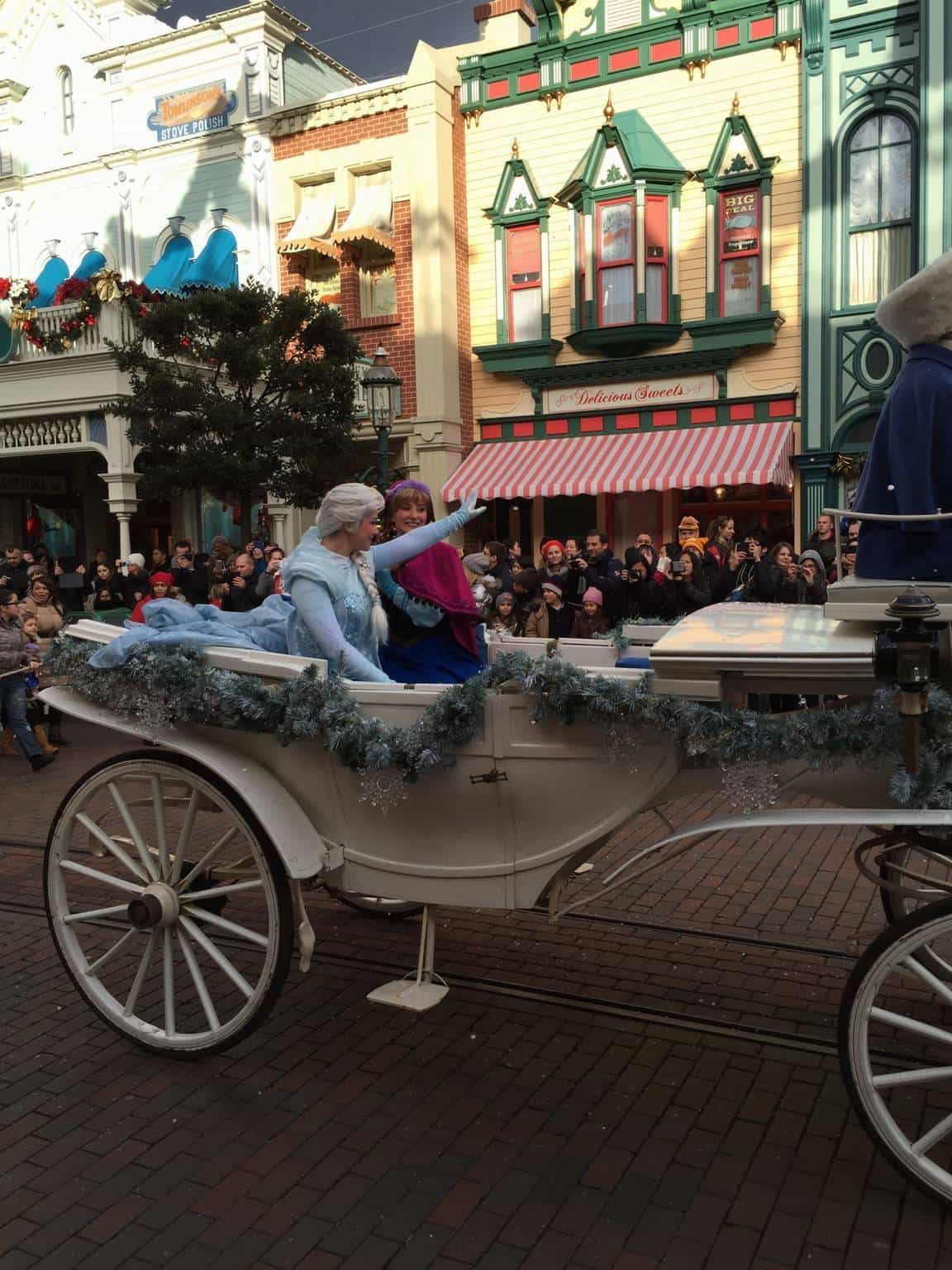 Elsa and Anna meet the crowds in Main Street USA.